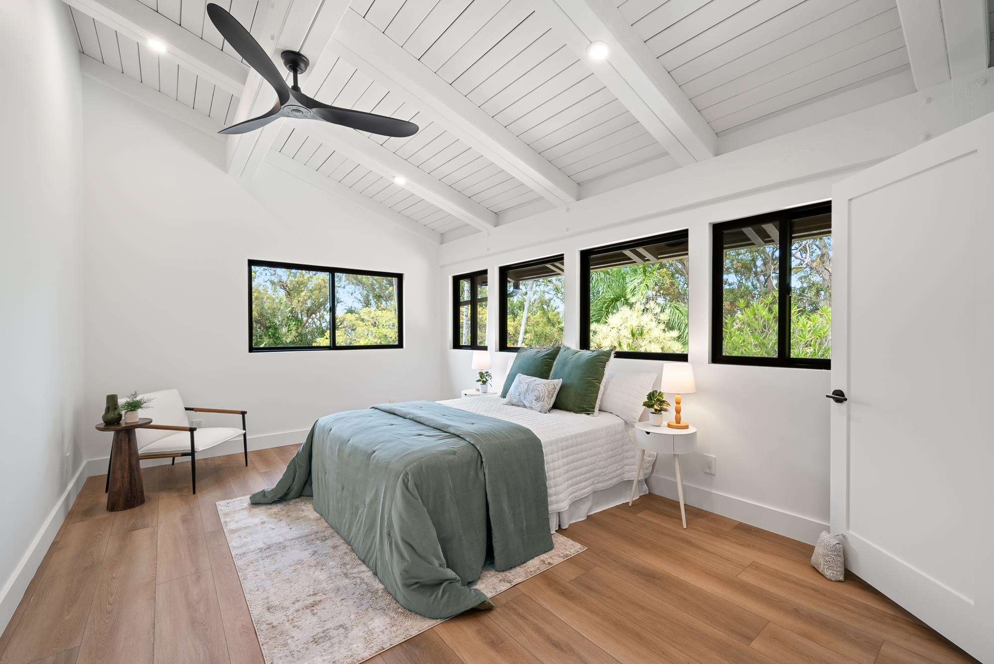 965 Hog Back Road Haiku, HI 96708 - Photo 21 of 44 a bedroom with a large bed and a window