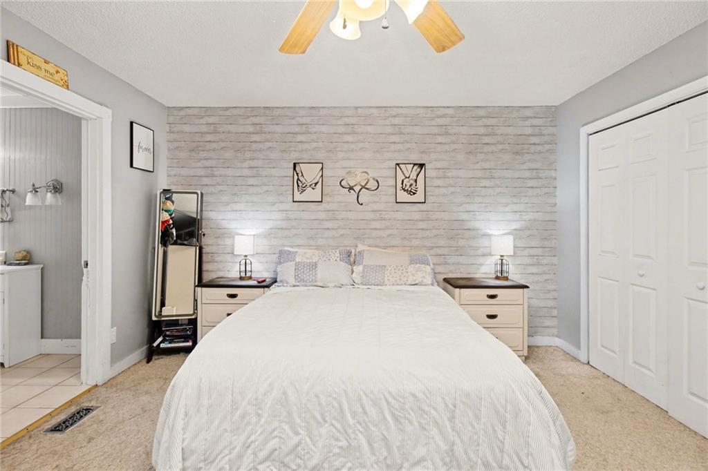 1932 River Bend Road Southwest Plainville, GA 30733 - Photo 18 of 30 a bed room with a bed and a television