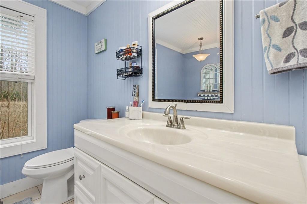 1932 River Bend Road Southwest Plainville, GA 30733 - Photo 19 of 30 a bathroom with a sink toilet and mirror