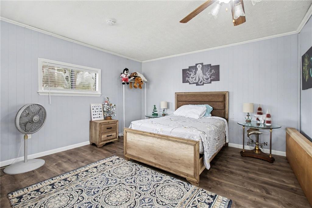 1932 River Bend Road Southwest Plainville, GA 30733 - Photo 22 of 30 a bedroom with a bed and cabinets