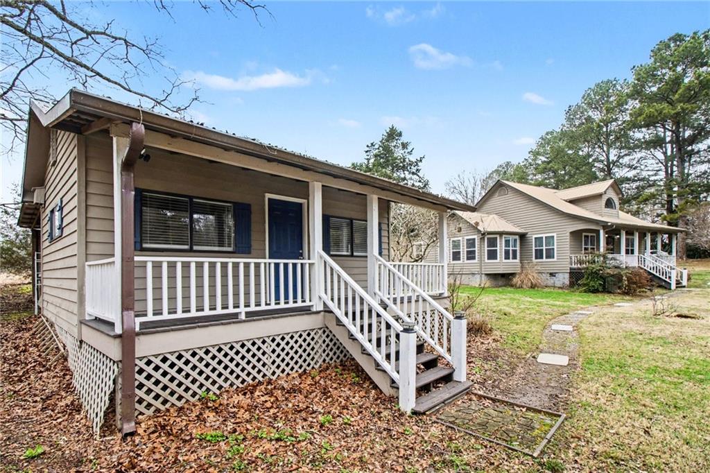 1932 River Bend Road Southwest Plainville, GA 30733 - Photo 30 of 30 a view of a house with a deck