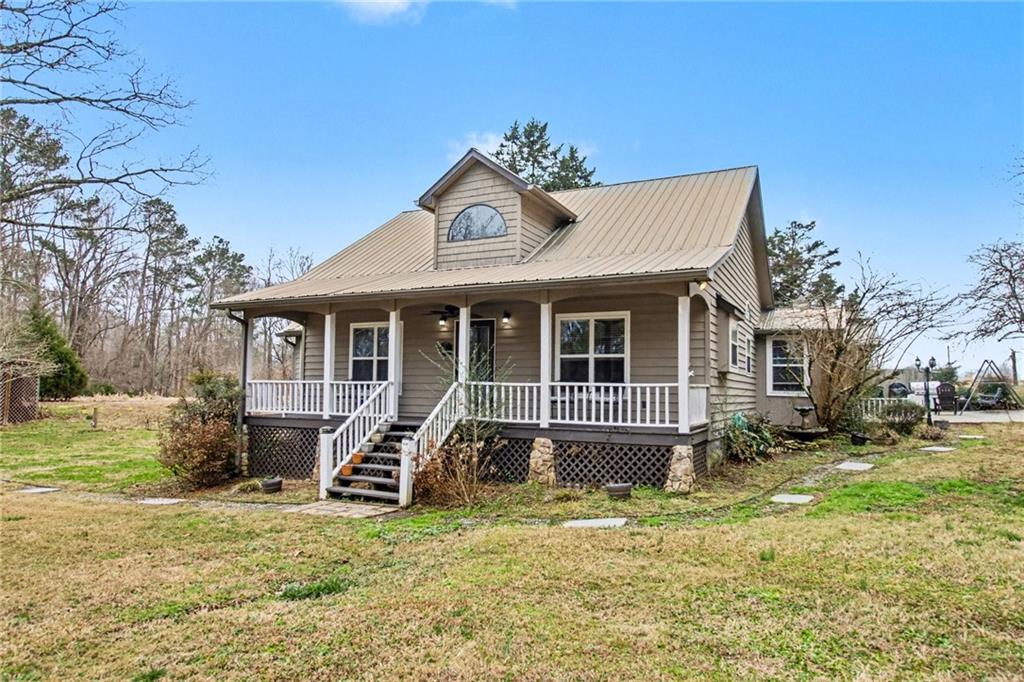 1932 River Bend Road Southwest Plainville, GA 30733 - Photo 3 of 30 a front view of a house with a yard