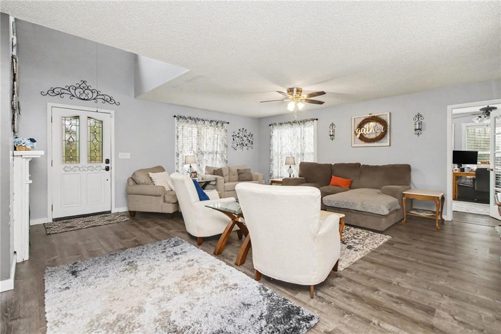 1932 River Bend Road Southwest Plainville, GA 30733 - Photo 5 of 30 a living room with furniture and a window