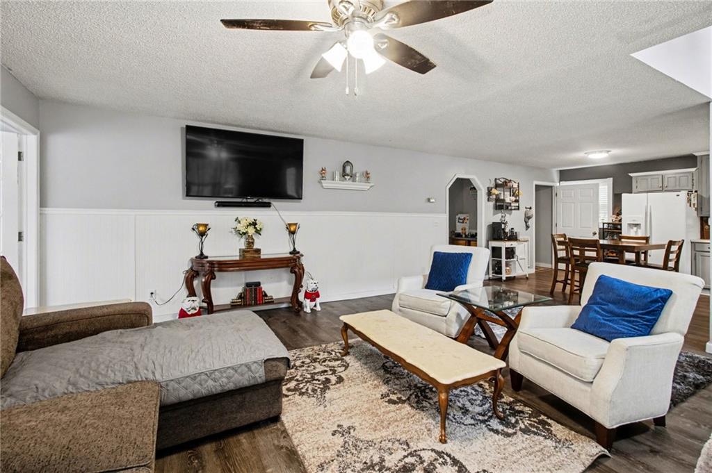 1932 River Bend Road Southwest Plainville, GA 30733 - Photo 6 of 30 a living room with furniture and a flat screen tv