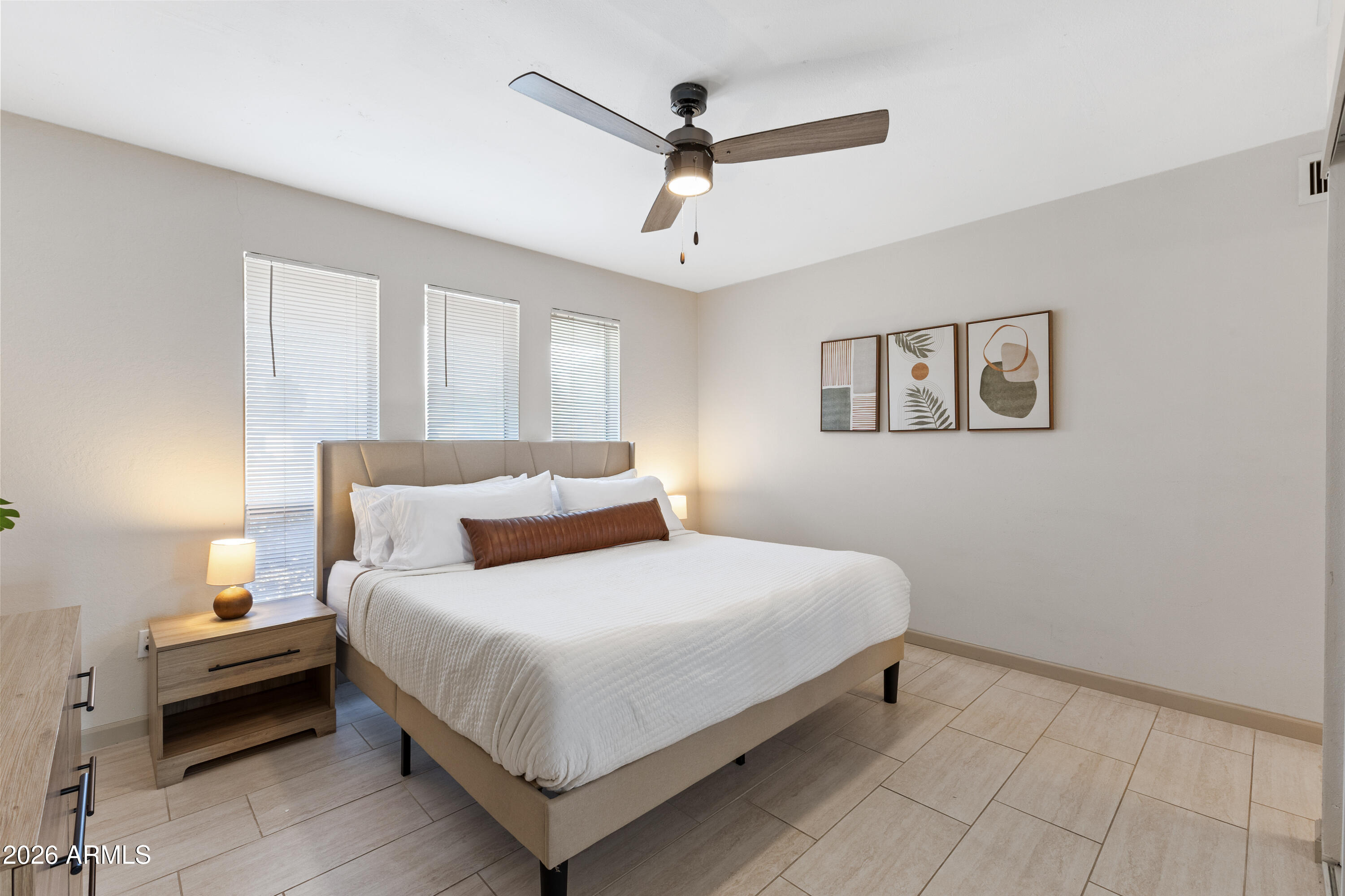 111 South Cholla Street Gilbert, AZ 85233 - Photo 18 of 34 a bedroom with a bed and a ceiling fan