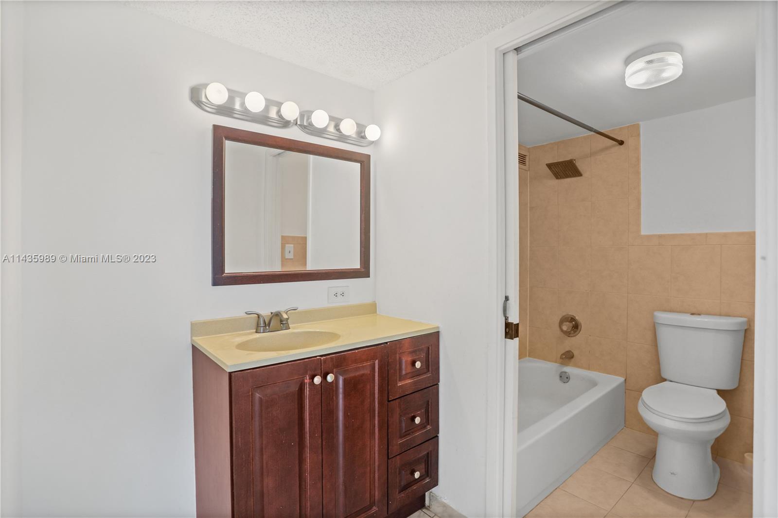 17021 North Bay Road, Unit 418 Sunny Isles Beach, FL 33160 - Photo 15 of 43 a bathroom with a sink a toilet and bathtub