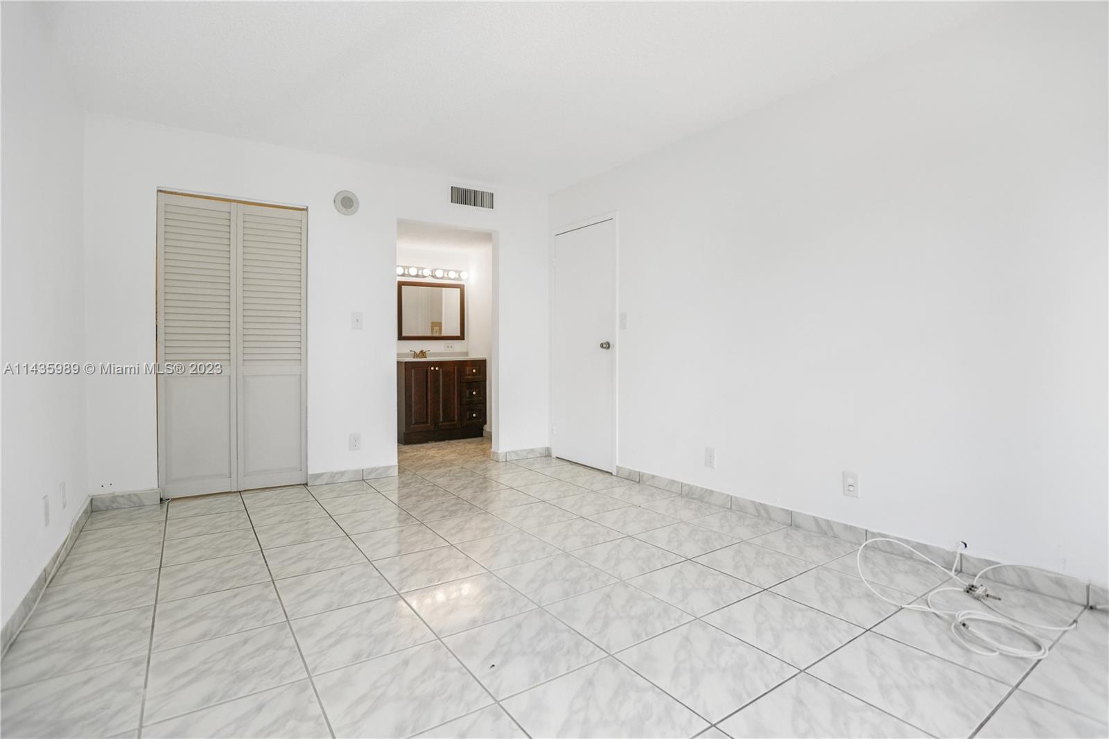 17021 North Bay Road, Unit 418 Sunny Isles Beach, FL 33160 - Photo 25 of 43 an empty room with a natural light