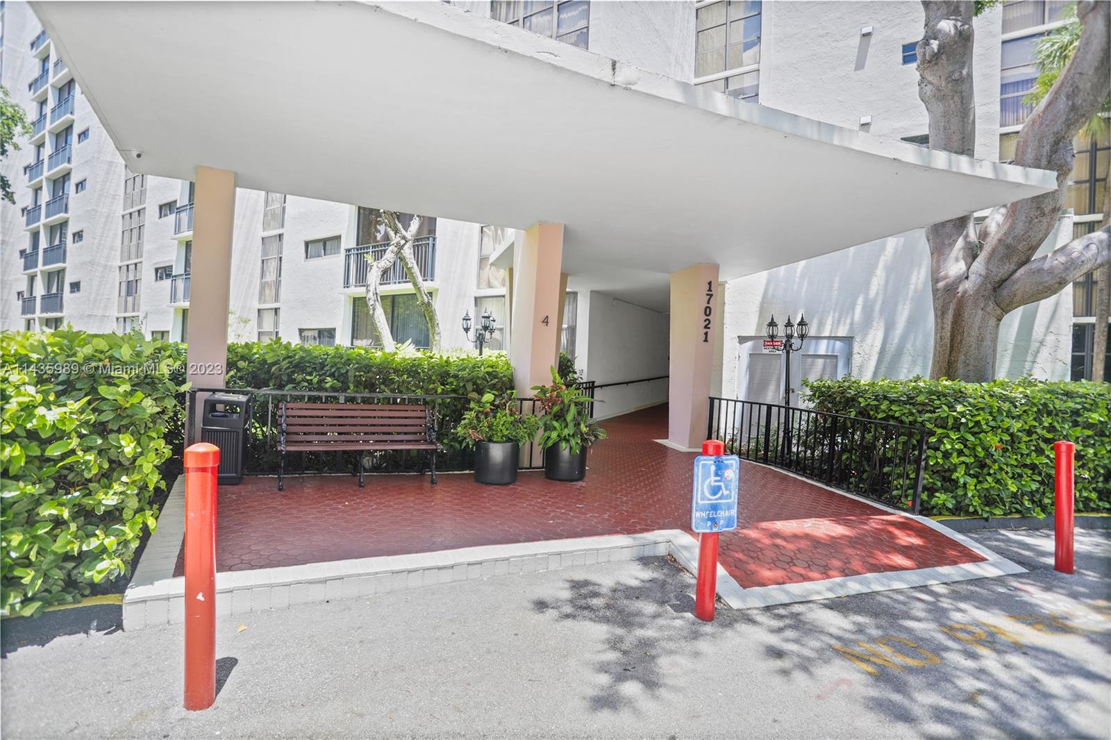 17021 North Bay Road, Unit 418 Sunny Isles Beach, FL 33160 - Photo 3 of 43 a backyard of a house with a yard and plants