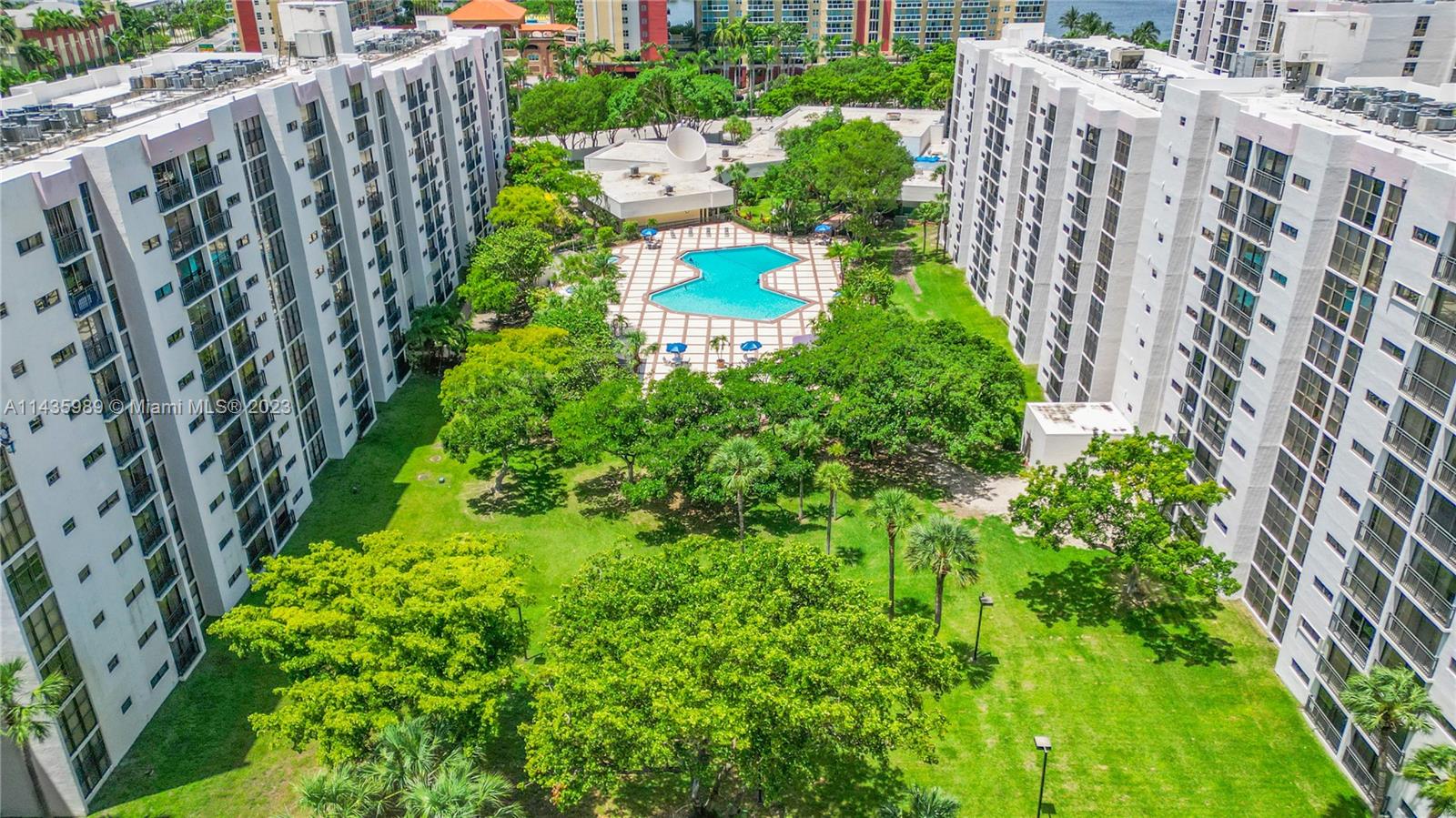 17021 North Bay Road, Unit 418 Sunny Isles Beach, FL 33160 - Photo 38 of 43 a view of a garden with wooden fence