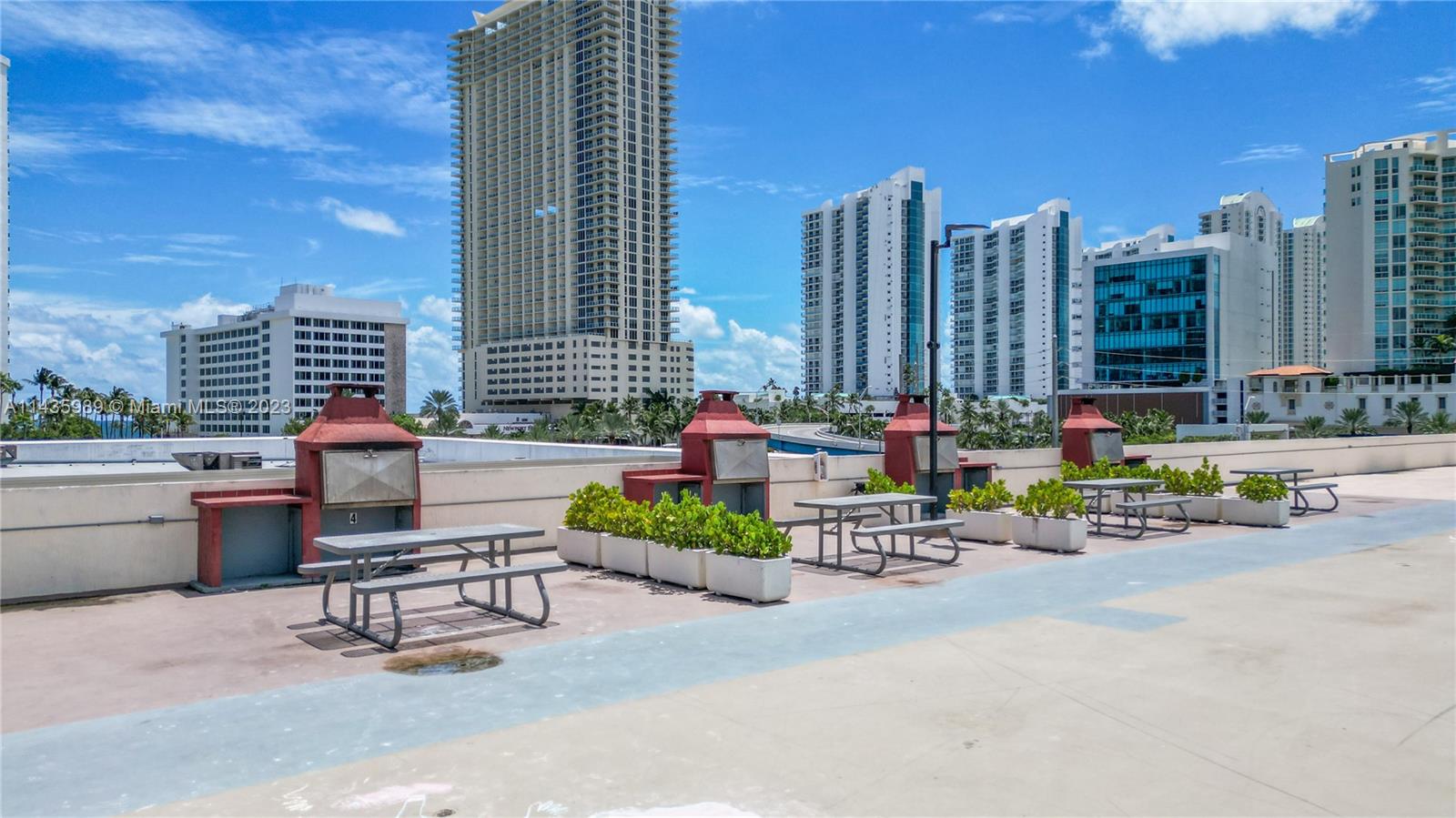 17021 North Bay Road, Unit 418 Sunny Isles Beach, FL 33160 - Photo 41 of 43 a sitting area with chairs and a table