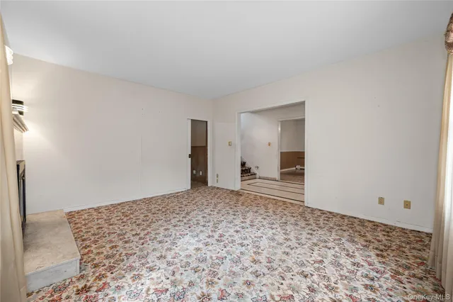 a view of a room with a wooden floor