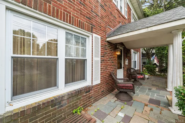 a view of a bench in front of house