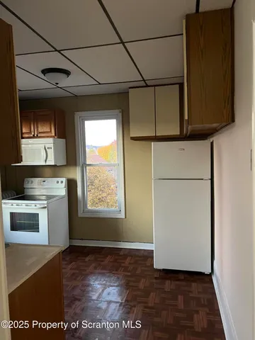 a view of a kitchen with a sink and dishwasher