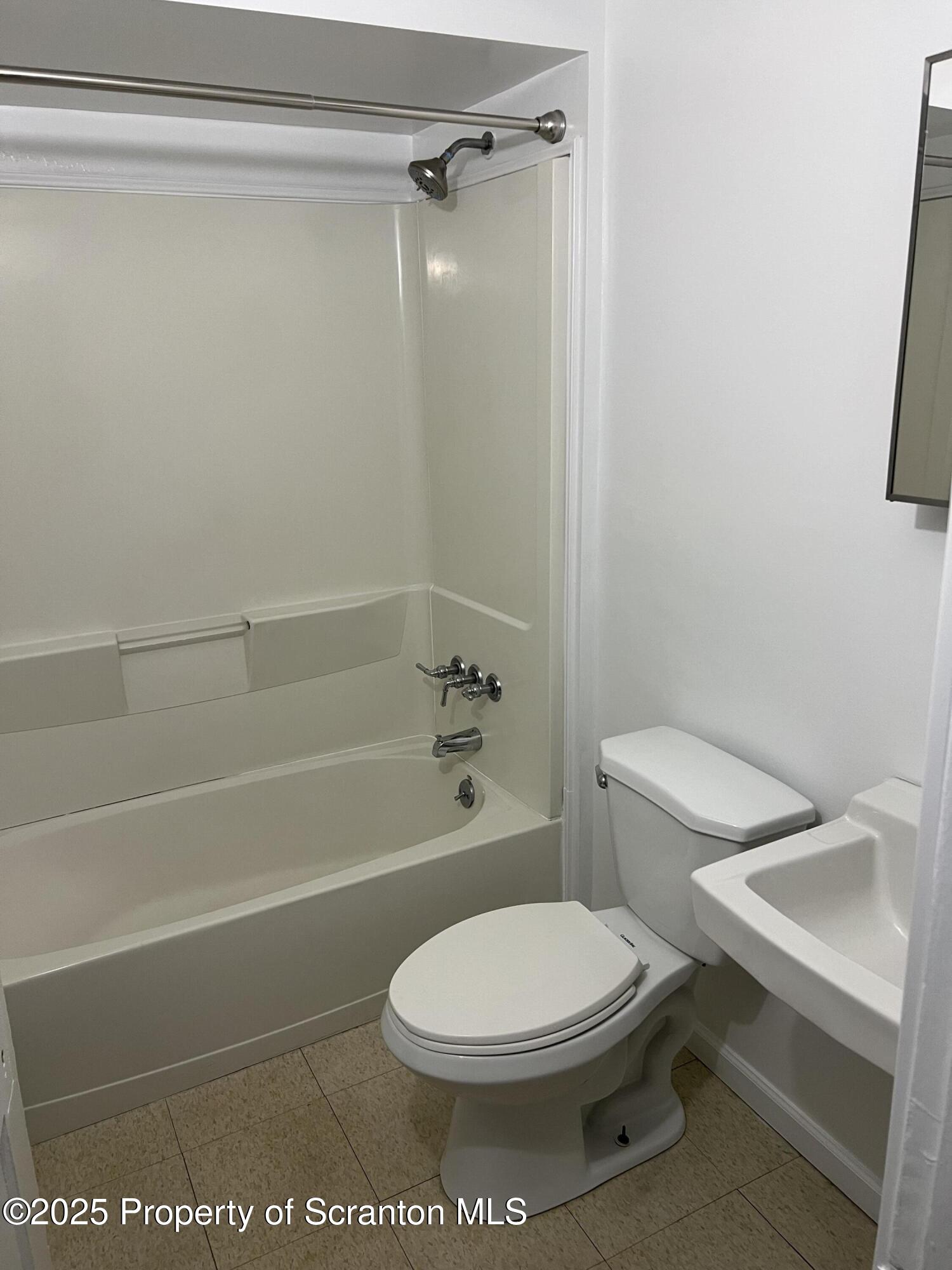 1330 Pittston Avenue, Unit 2N Scranton, PA 18505 - Photo 12 of 12 a bathroom with a toilet and shower