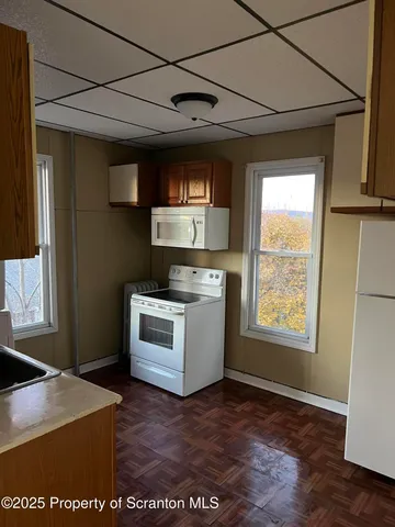 a kitchen with a stove and a microwave
