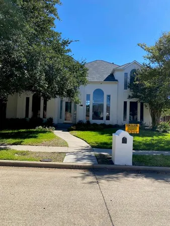 a view of a house with swimming pool and a yard