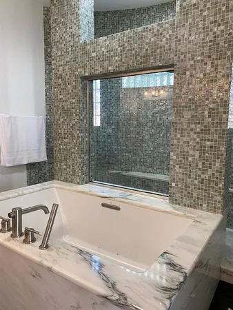 a bathroom with a bathtub and a sink
