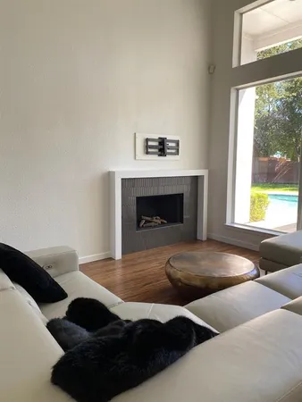 a bedroom with a bed and a fireplace