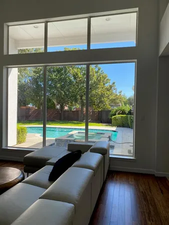 a room with furniture and a large window