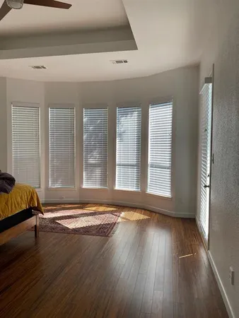 a view of room with window and hardwood floor