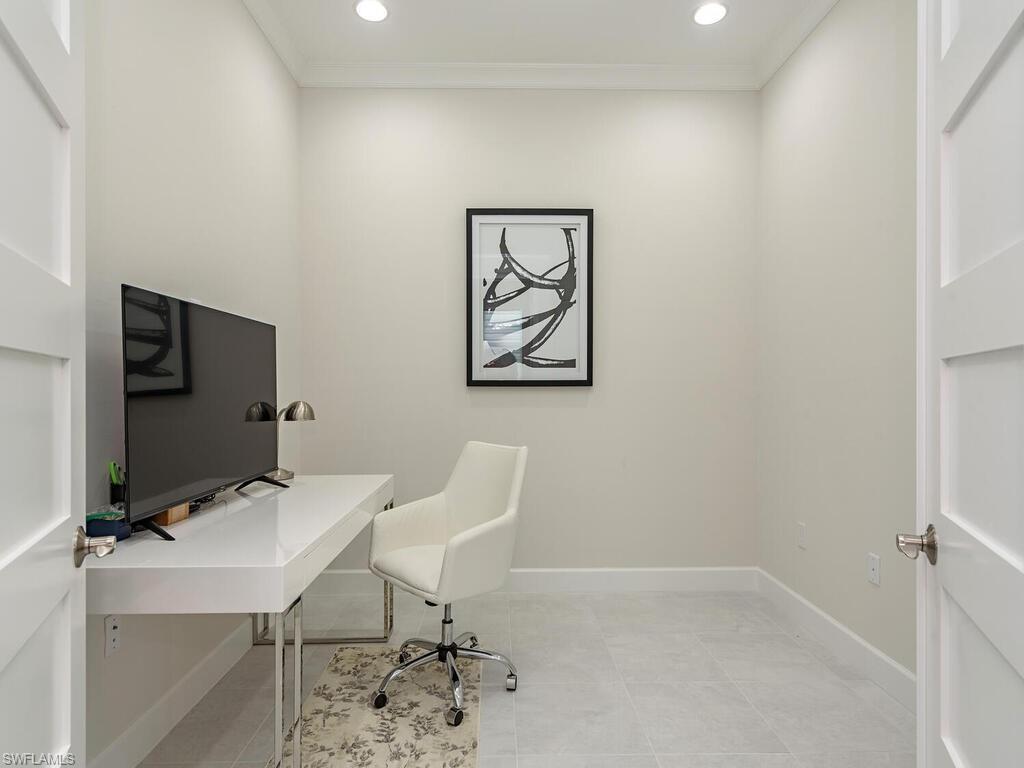 6895 Saona Court Naples, FL 34113 - Photo 13 of 33 a view of a workspace with furniture