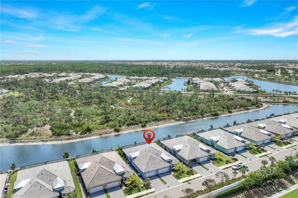 6895 Saona Court Naples, FL 34113 - Photo 21 of 33 an aerial view of residential house with outdoor space