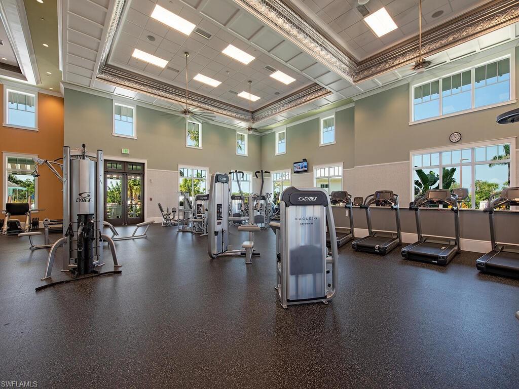 6895 Saona Court Naples, FL 34113 - Photo 29 of 33 a view of a room with gym equipment