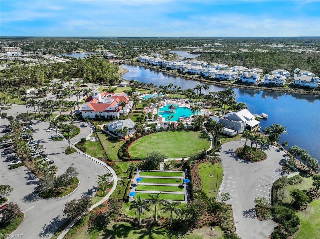 6895 Saona Court Naples, FL 34113 - Photo 32 of 33 an aerial view of a house with a lake view