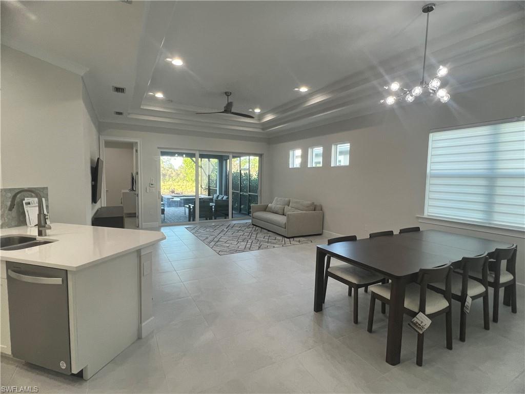 6895 Saona Court Naples, FL 34113 - Photo 5 of 33 a view of a a dining room with furniture window and outside view