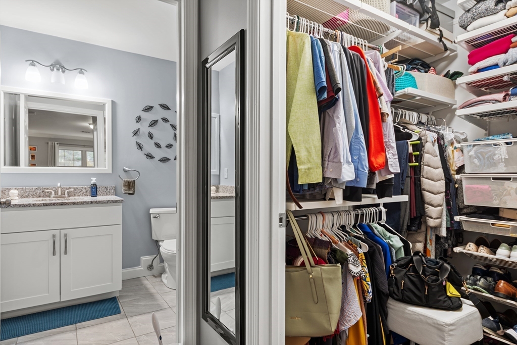 24 Shayne Road, Unit 219 Franklin, MA 02038 - Photo 13 of 23 a view of walk in closet with clothes and shoes
