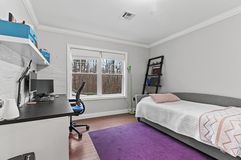 24 Shayne Road, Unit 219 Franklin, MA 02038 - Photo 15 of 23 a bedroom with a bed and a desk
