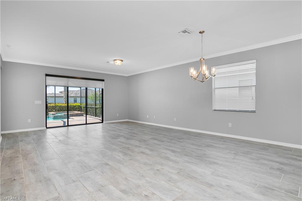 19952 Beverly Park Road Estero, FL 33928 - Photo 3 of 32 a view of an empty room with a window