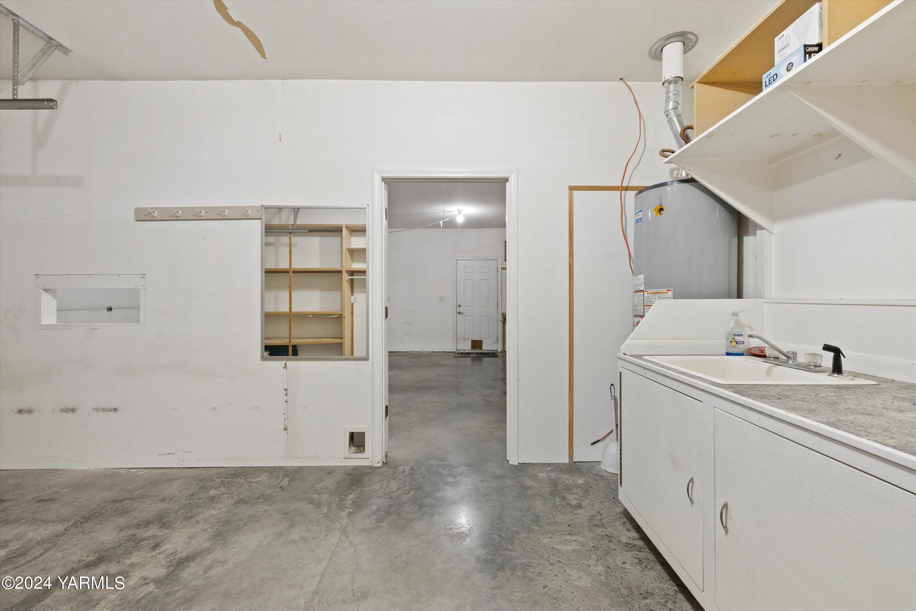 12555 West Barrett Road Yakima, WA 98908 - Photo 16 of 27 a view of a storage & utility room with closet dryer
