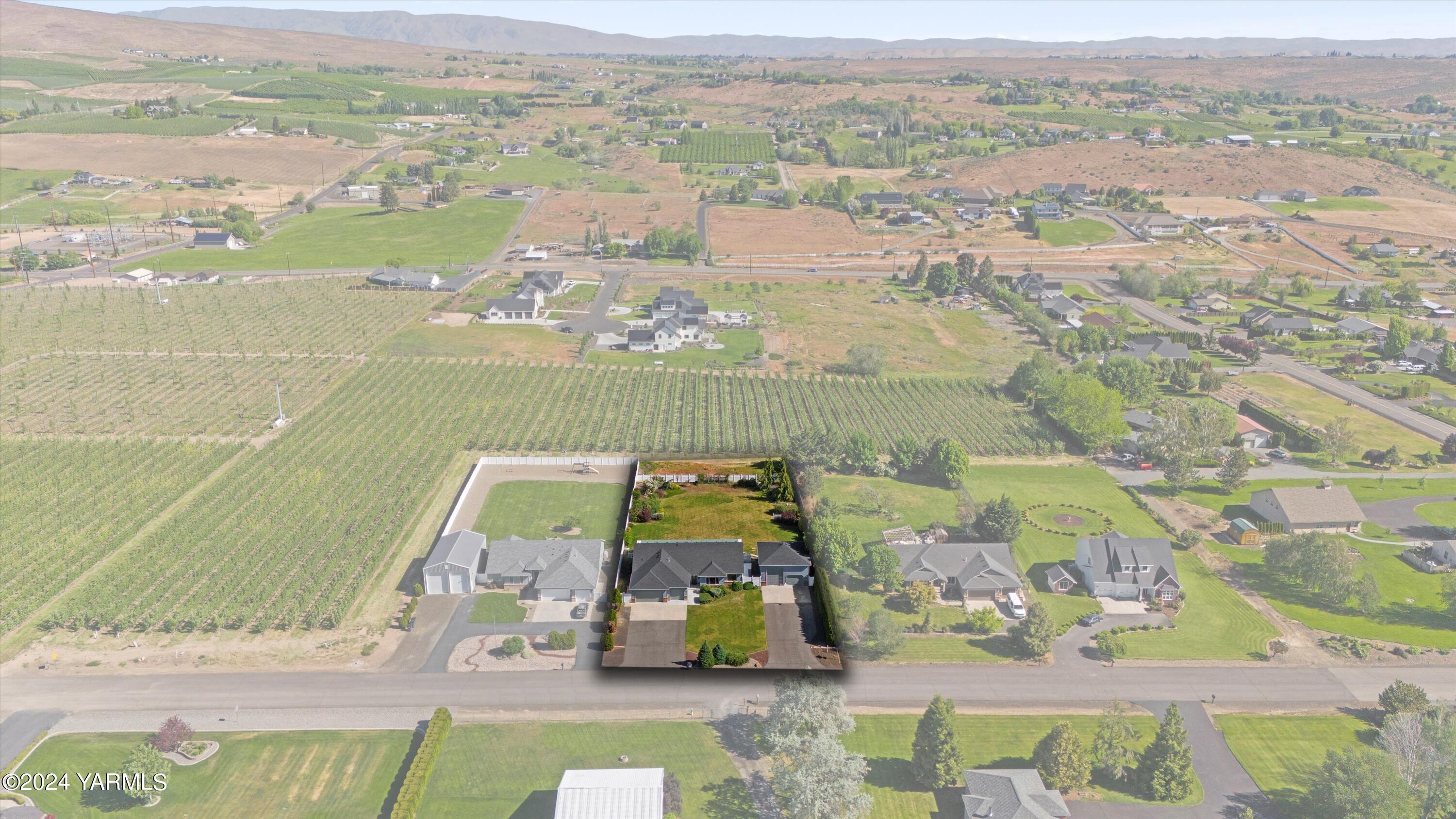 12555 West Barrett Road Yakima, WA 98908 - Photo 25 of 27 an aerial view of residential houses with outdoor space