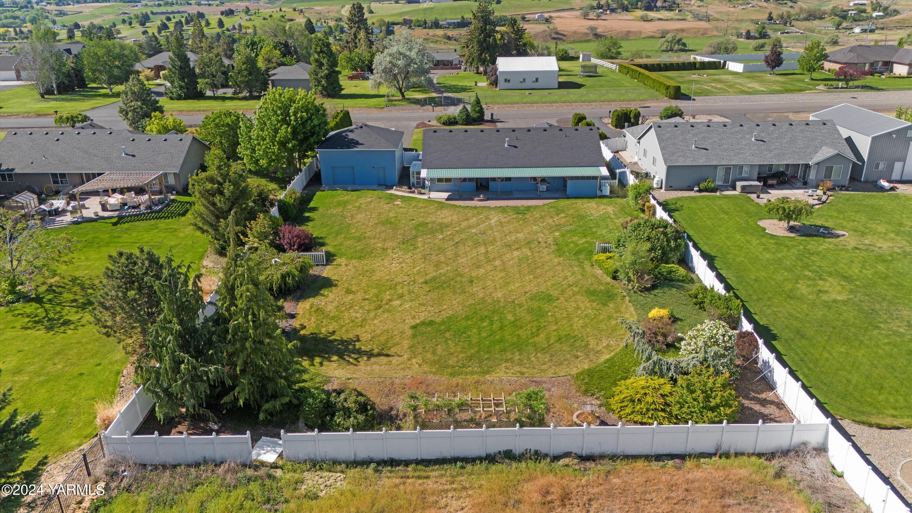 12555 West Barrett Road Yakima, WA 98908 - Photo 26 of 27 an aerial view of a house with a garden and lake view