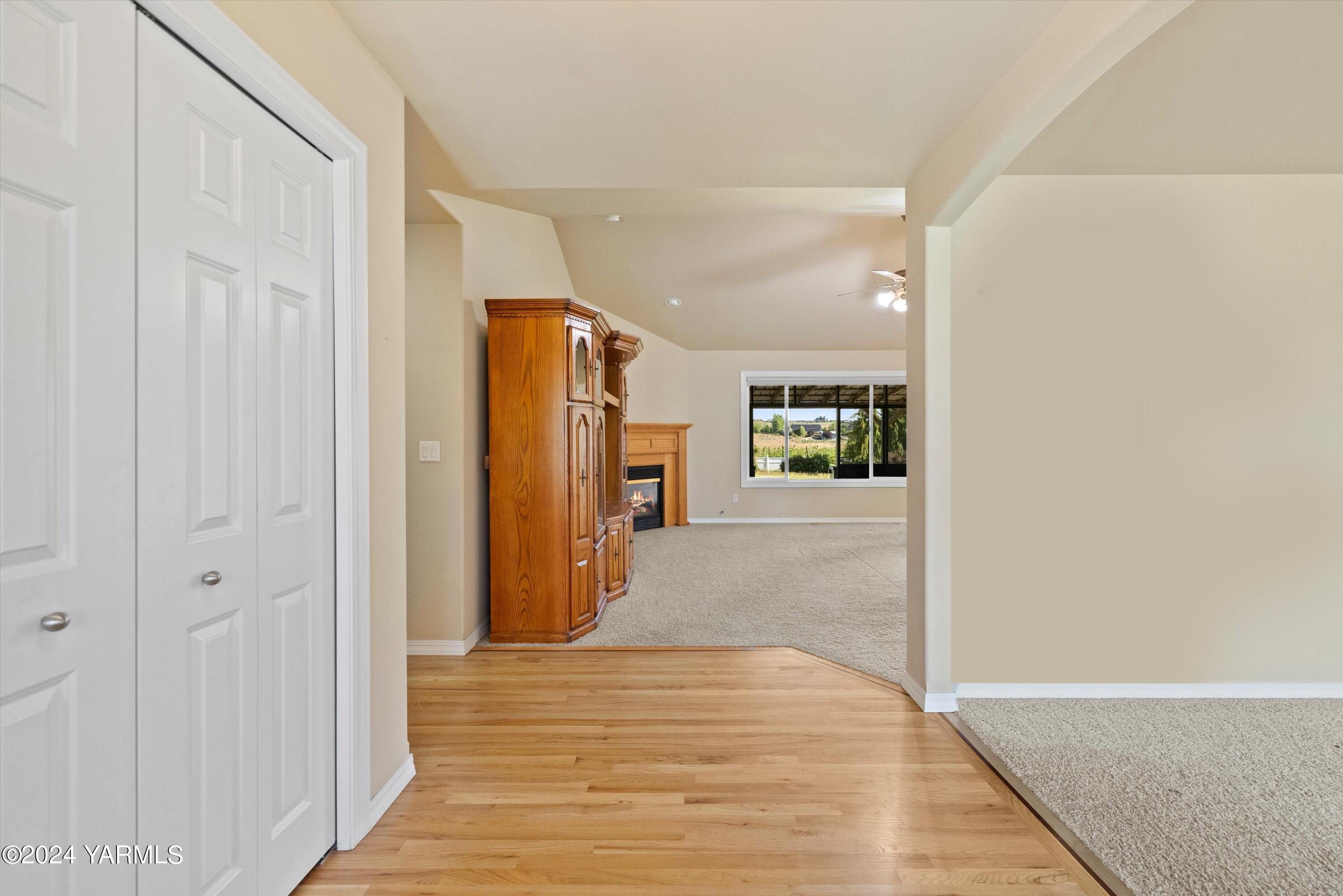 12555 West Barrett Road Yakima, WA 98908 - Photo 4 of 27 a view of a hallway with wooden floor and closet