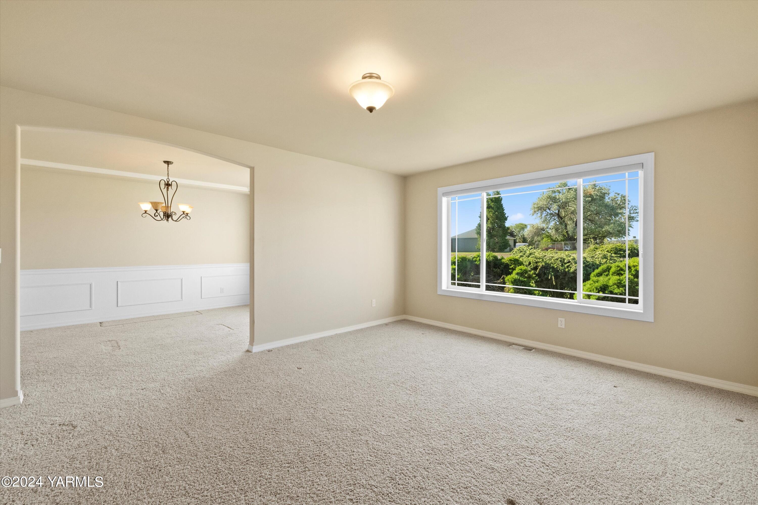 12555 West Barrett Road Yakima, WA 98908 - Photo 5 of 27 a view of an empty room with a window