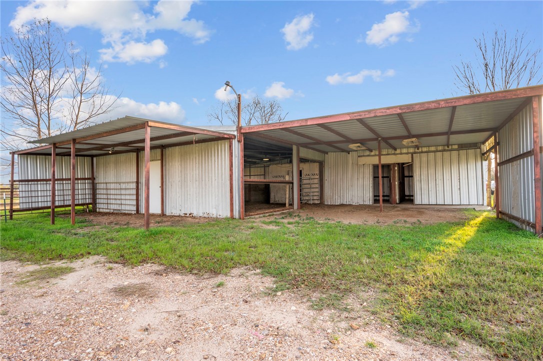 3840 Mancuso Road Bryan, TX 77808 - Photo 20 of 31 a front view of a house with a garden and yard