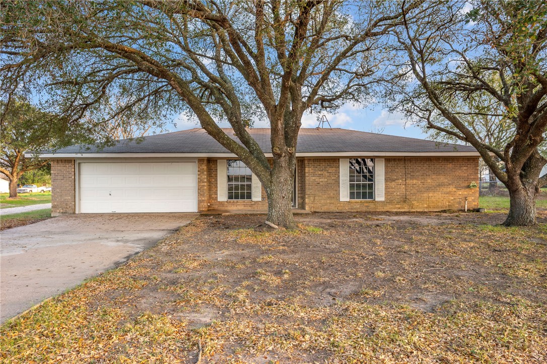 3840 Mancuso Road Bryan, TX 77808 - Photo 2 of 31 front view of a house with a trees