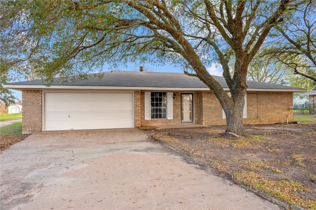 3840 Mancuso Road Bryan, TX 77808 - Photo 3 of 31 a house with a tree in front of it