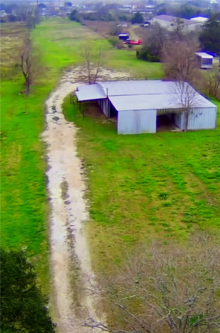 3840 Mancuso Road Bryan, TX 77808 - Photo 31 of 31 a view of yard with swimming pool and green space