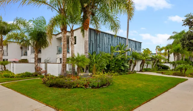 a view of a swimming pool with lounge chairs