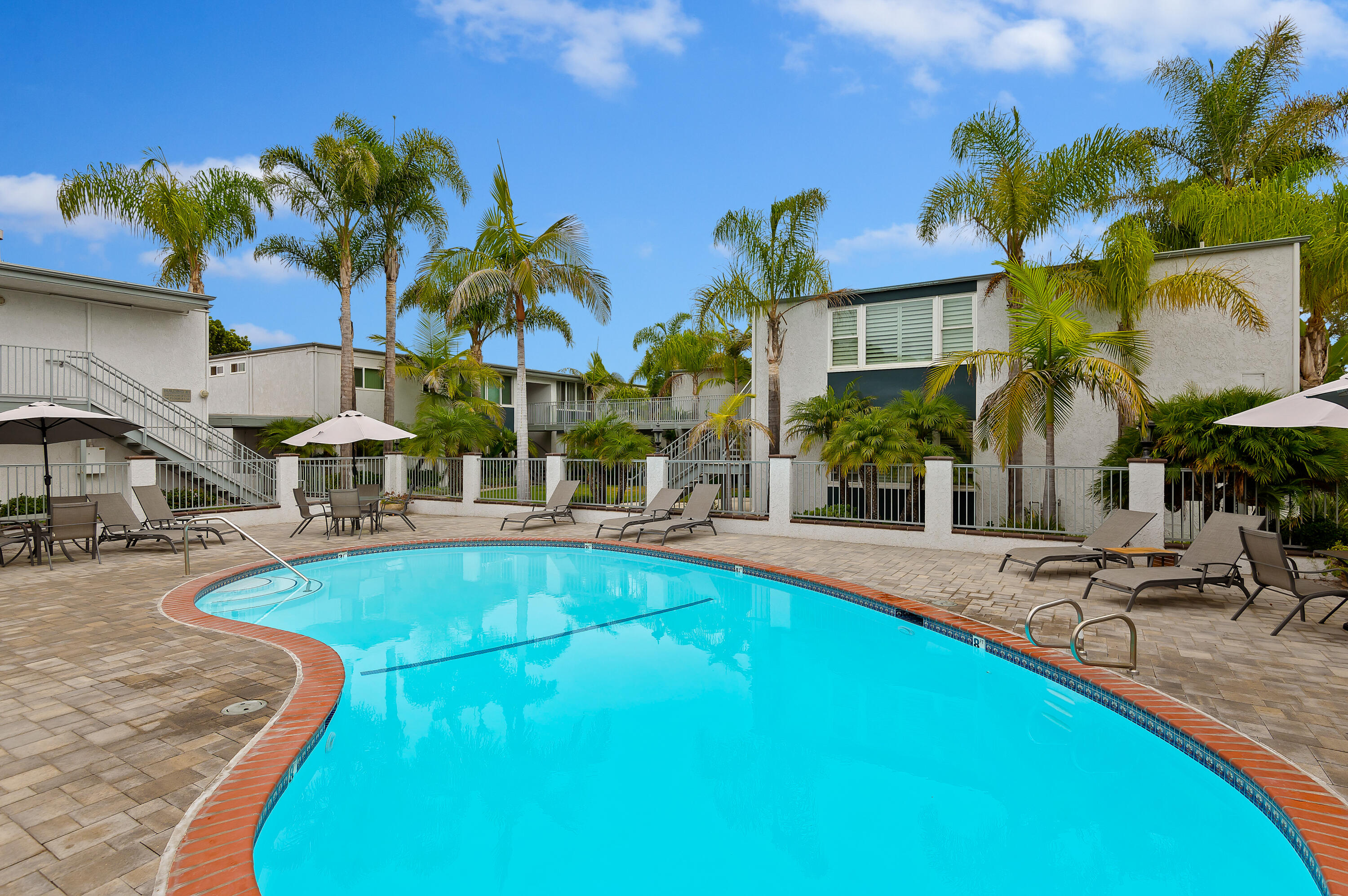 4880 Sandyland Road, Unit 48 Carpinteria, CA 93013 - Photo 19 of 29 a view of a swimming pool with lounge chairs