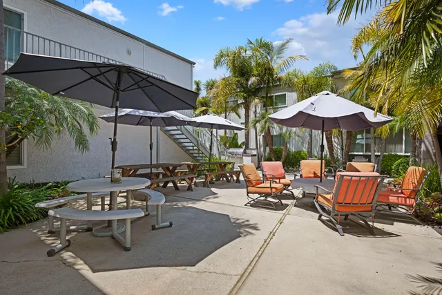 an outdoor space with patio and umbrella