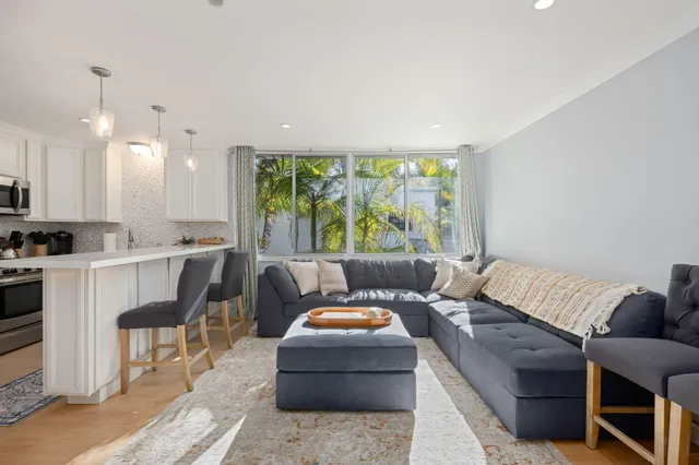 a view of a livingroom with furniture and a flat screen tv