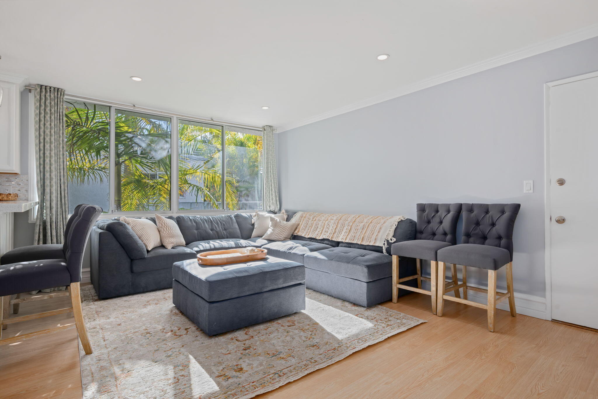 4880 Sandyland Road, Unit 48 Carpinteria, CA 93013 - Photo 5 of 29 a living room with furniture and a large window