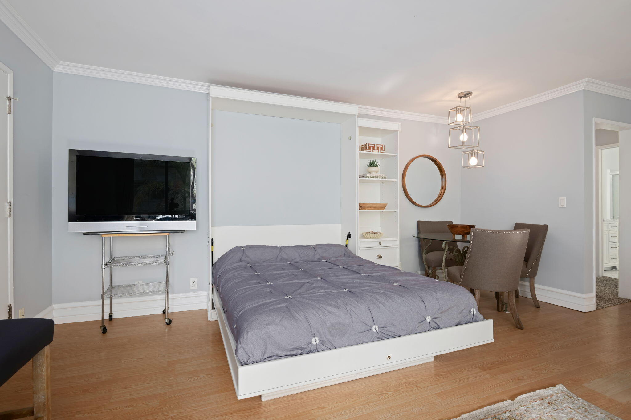 4880 Sandyland Road, Unit 48 Carpinteria, CA 93013 - Photo 7 of 29 a bedroom with a bed window and a flat screen tv