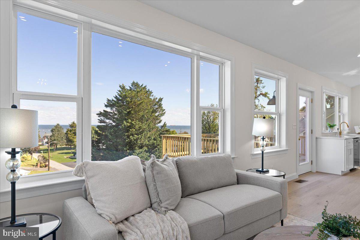 2825 Ridge Road Huntingtown, MD 20639 - Photo 11 of 67 a living room with furniture a window and a potted plant