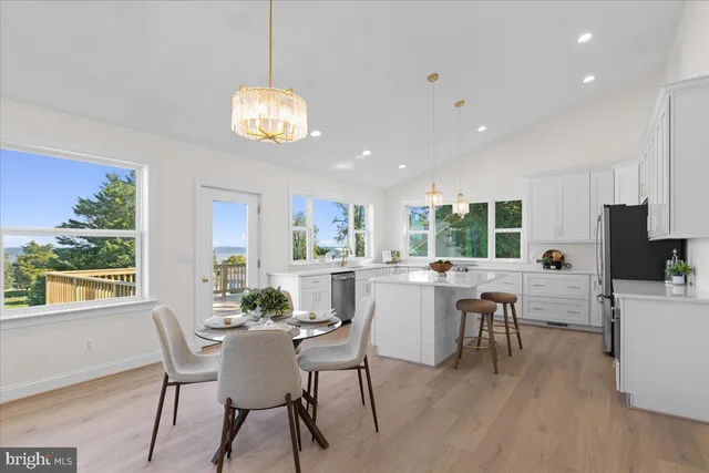 a kitchen with a sink stove a refrigerator and cabinets