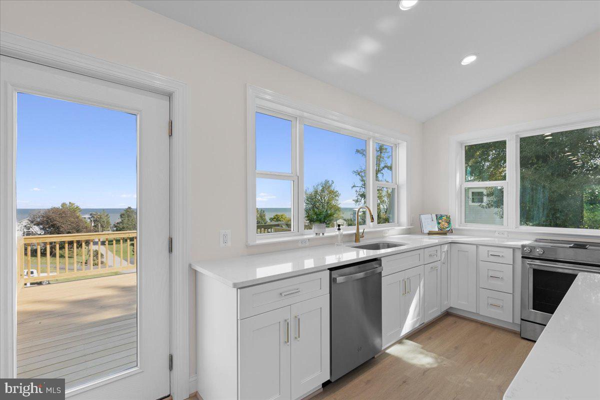 2825 Ridge Road Huntingtown, MD 20639 - Photo 15 of 67 a kitchen with a sink stove and cabinets